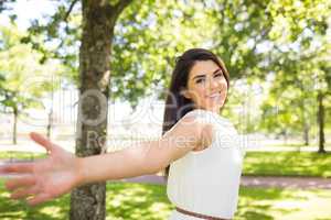 Portrait of happy woman with arms outstretched