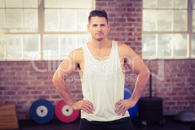 Muscular serious man facing the camera