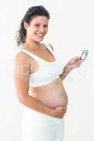 Pregnant woman holding an ultrasound scan