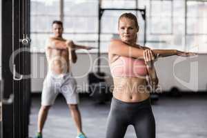 Two fit people doing fitness