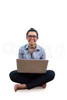 Smiling businesswoman using her laptop