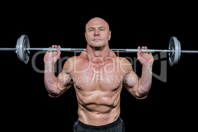 Portrait of confident man lifting crossfit