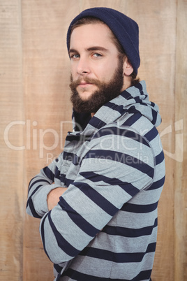 Portrait of confident hipster with hooded shirt