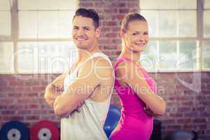 Fit couple smiling in crossfit
