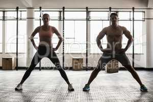 Two fit people doing fitness