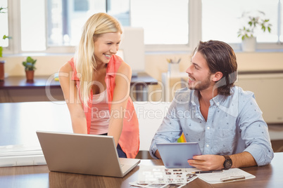 Smiling usiness people looking at documents