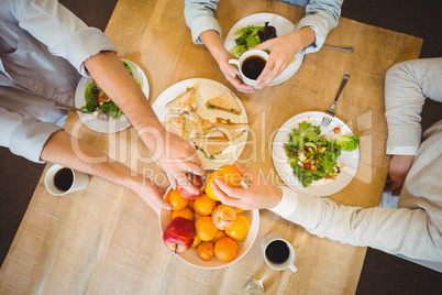 Business people having breakfast in canteen