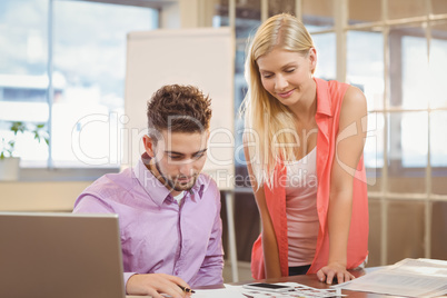 Business people looking at documents