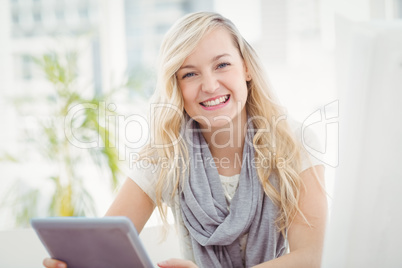 Portrait of happy woman holding digital tablet Portrait of happy woman holding digital tablet
