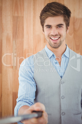 Portrait of happy businessman holding selfie stick