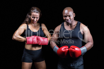 Portrait of male and female boxers with gloves