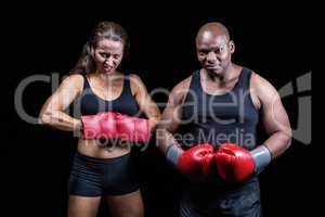 Portrait of male and female boxers with gloves