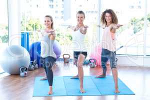 Smiling women with arms outstretched