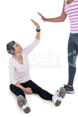 Happy fit women high fiving