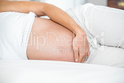 Midsection of woman lying