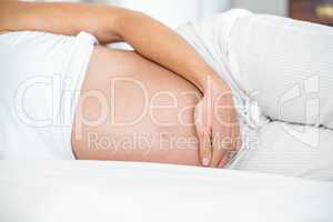 Midsection of woman lying