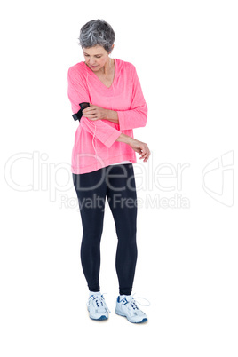 Full length of fit woman wearing armband