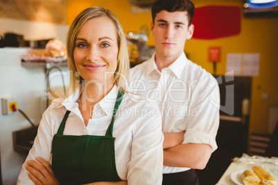 Confident colleagues in bakery