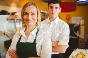 Confident colleagues in bakery