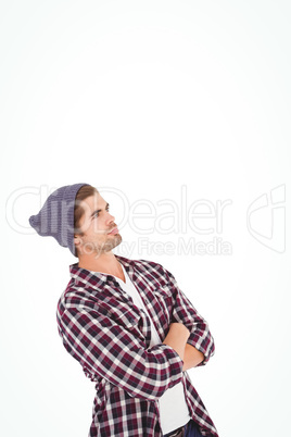 Man with arms crossed looking up