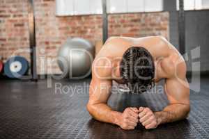 Shirtless man doing push ups