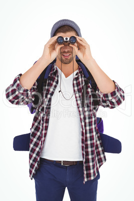 Man looking through binoculars