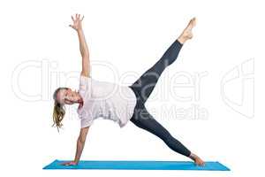 Portrait of fit woman exercising on mat