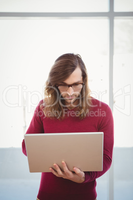 Man using laptop in office