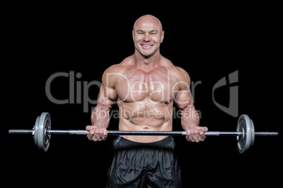Portrait of happy muscular man lifting crossfit