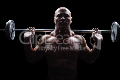 Portrait of bald man lifting crossfit