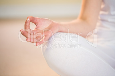 Mid section of woman in yoga pose