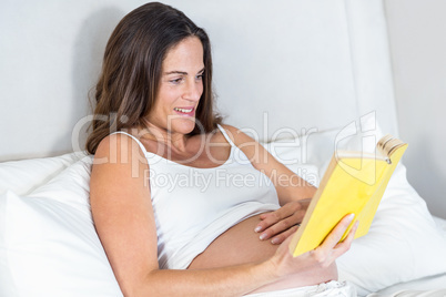Happy woman reading novel