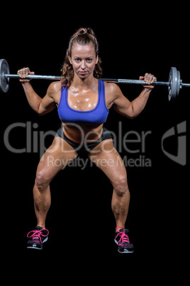 Portrait full length of woman lifting crossfit