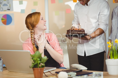 Happy businesswoman celebrating birthday