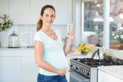 Portrait of happy woman with water glass