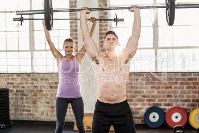 Two fit people working out