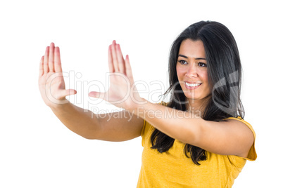 Woman using hands to make a box shape