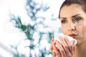 Beautiful woman holding coffee cup