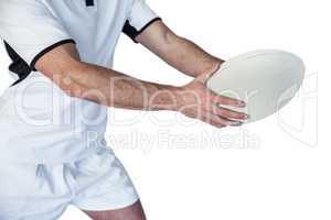 Midsection of rugby player holding the ball