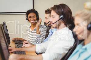 Portrait of smiling businesswoman in call center