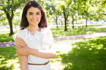 Portrait of happy confident woman in park