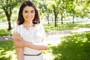 Portrait of happy confident woman in park