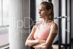 Muscular serious woman thinking