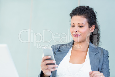 Businesswoman using smart phone
