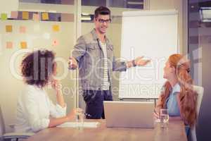 Businessman explaining female colleagues