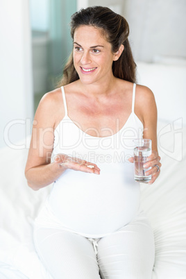 Happy woman with pills