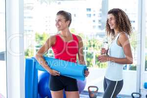 Cheerful women in fitness studio