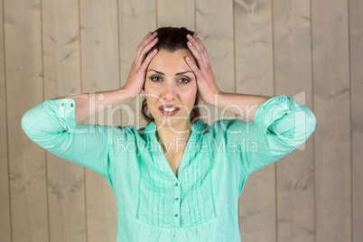 Portrait of woman suffering from headache