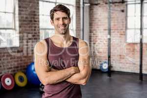 Portrait of man smiling with arms crossed