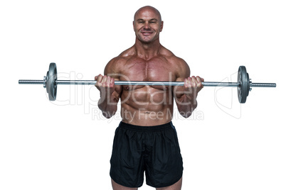 Portrait of smiling muscular man lifting crossfit
